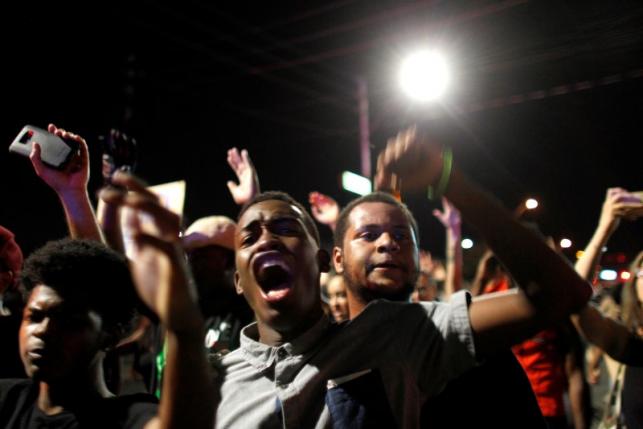 Protesters denounce fatal shootings by the police of two black men across the country during a demonstration, in Phoenix, Arizona